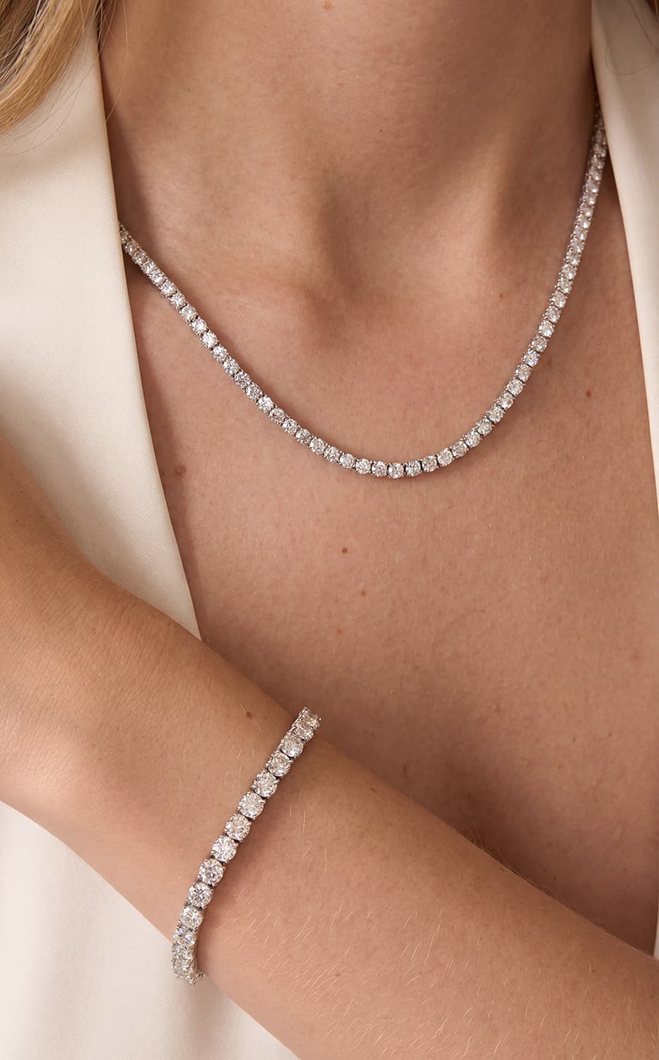Diamond necklace and bracelet worn together for buying fine jewelry online with confidence